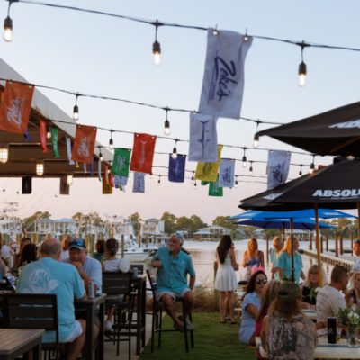 a group of people sitting at a table in a restaurant