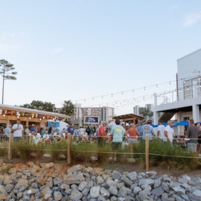 a group of people standing outside of a building