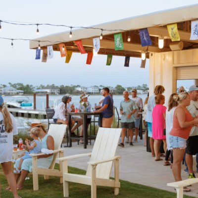 a group of people standing around a table