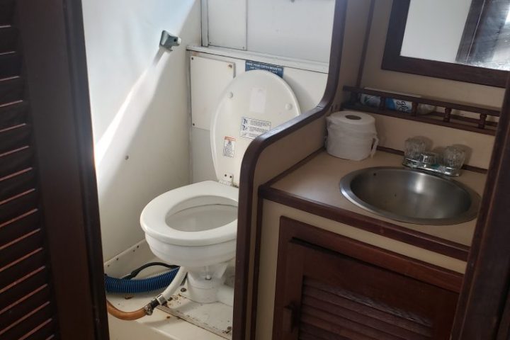 a restroom with a sink and a window