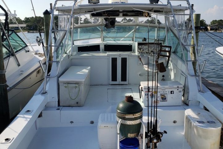 a boat is docked next to a body of water