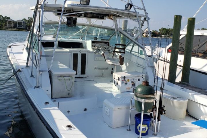 a boat is docked next to a body of water
