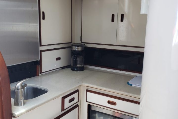 a stove top oven sitting inside of a kitchen