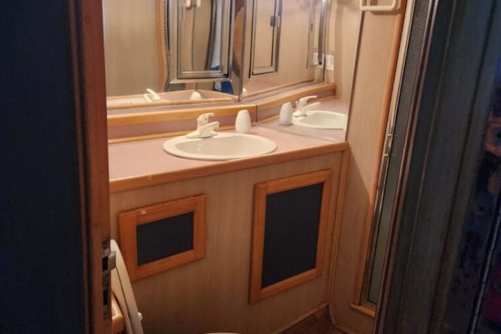 a kitchen with a sink and a mirror