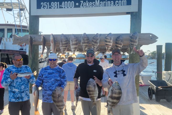 a group of people standing next to a sign