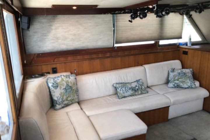 a bedroom with a bed and desk in a room