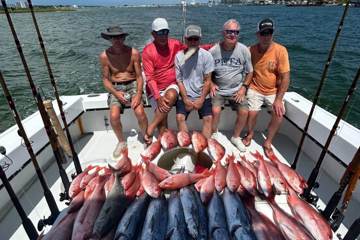 a group of people riding on the back of a crab on a boat