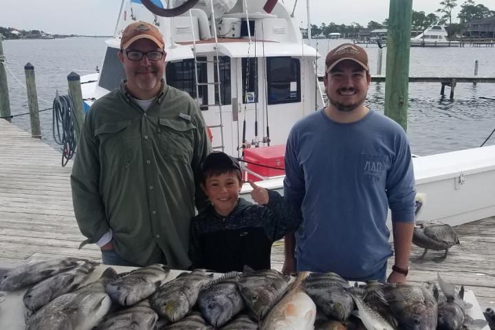 a man holding a fish