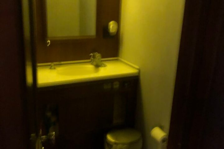 a restroom with a sink and a mirror