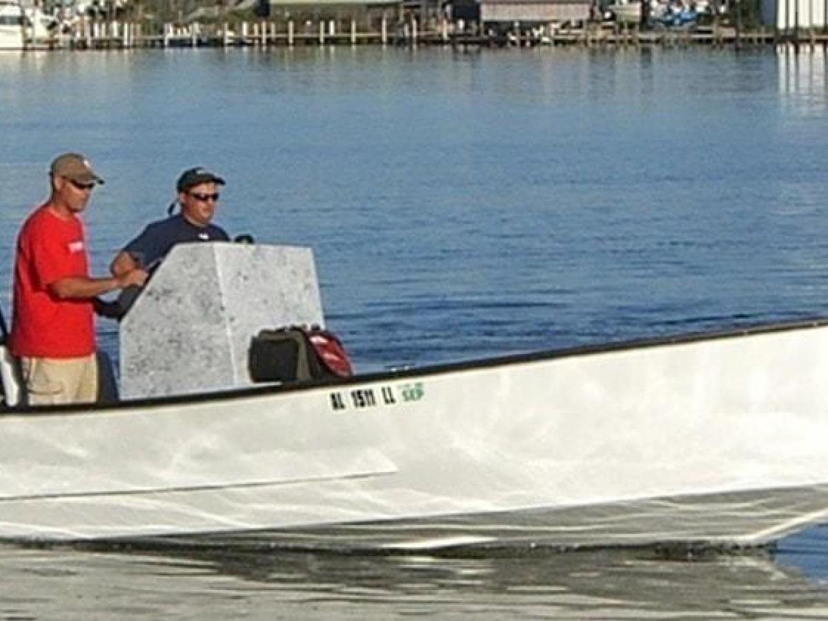 a man in a boat on a body of water