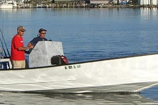 a man in a boat on a body of water