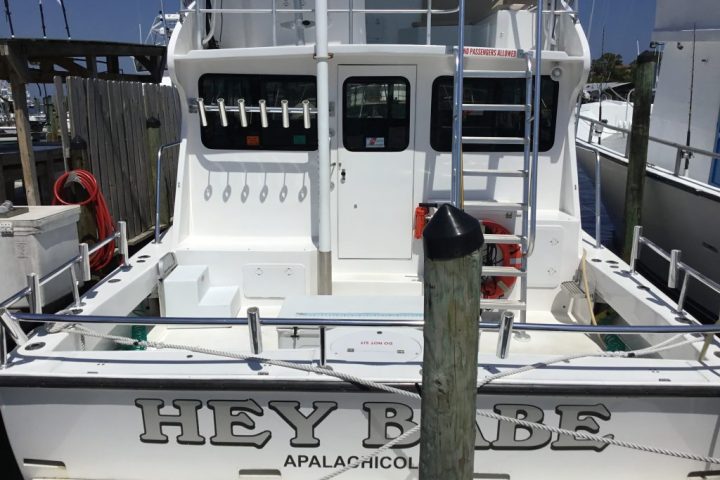 a boat sitting on top of a car