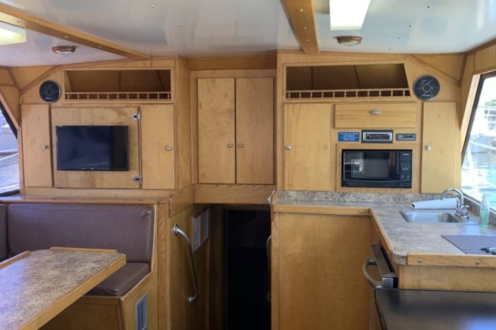a stove top oven sitting inside of a kitchen