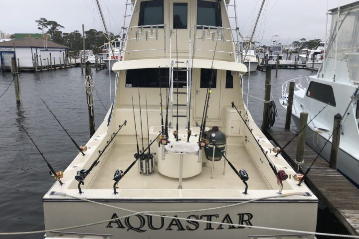 a boat is docked next to a body of water