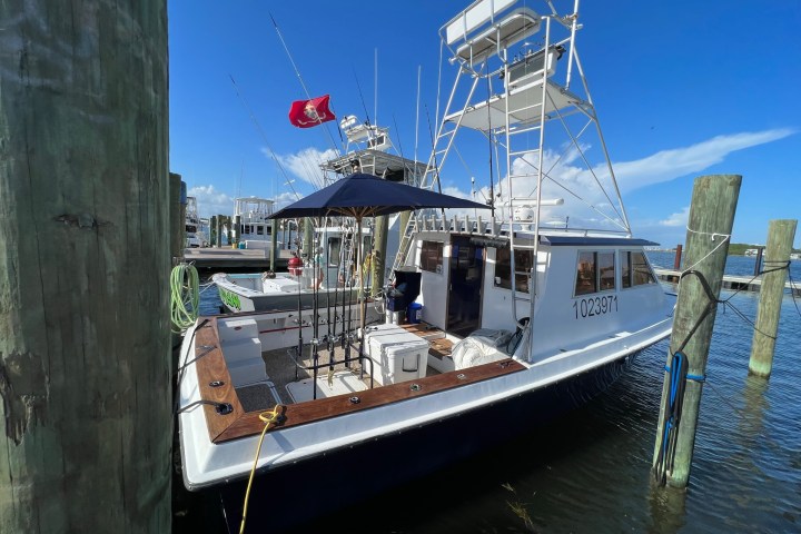 a boat is docked next to a body of water
