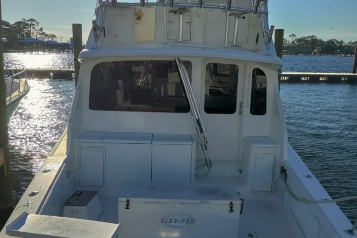 a close up of a boat next to a body of water