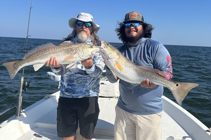 a man holding a fish