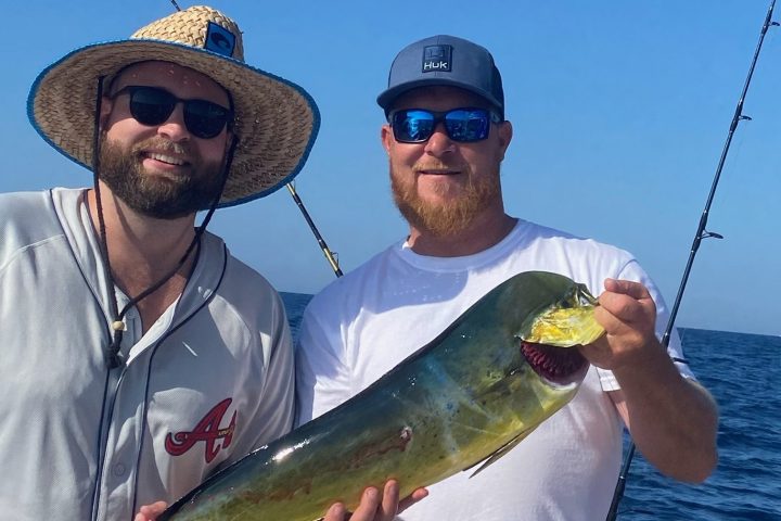 a man holding a fish