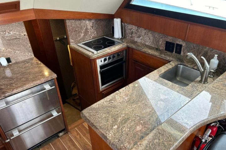a stove top oven sitting inside of a kitchen