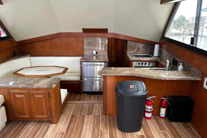 a kitchen with wooden cabinets and a wood floor