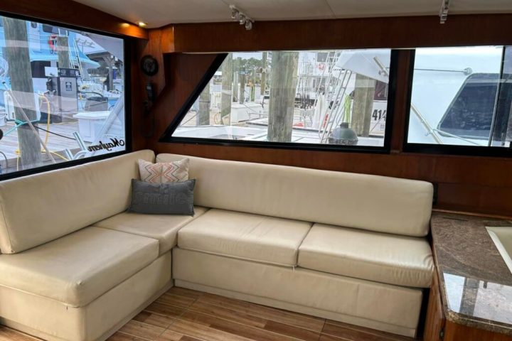 a living room filled with furniture and a large window