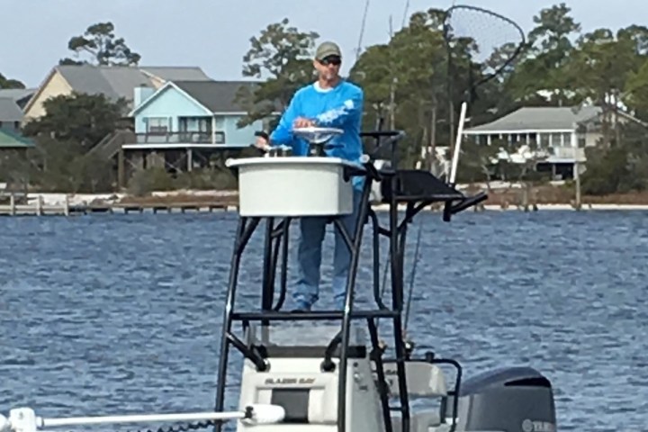 a man in a boat on a body of water