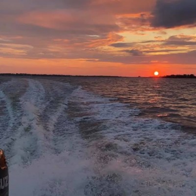 a sunset over a body of water