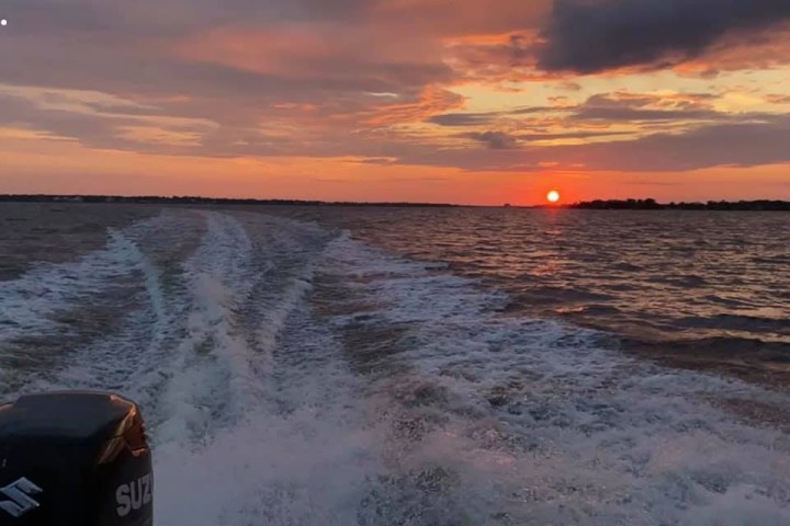 a sunset over a body of water