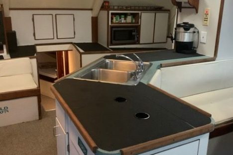 a stove top oven sitting inside of a kitchen