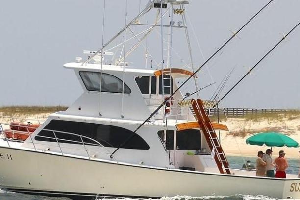 a boat is docked next to a body of water