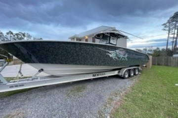 a boat parked on the side of a road
