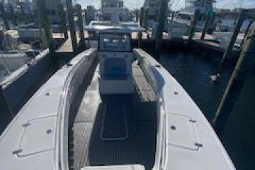 a boat sitting on top of a car