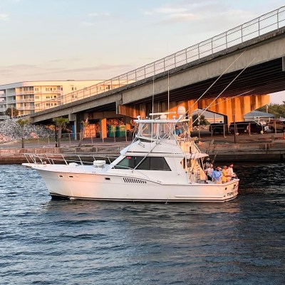 a boat is docked next to a body of water