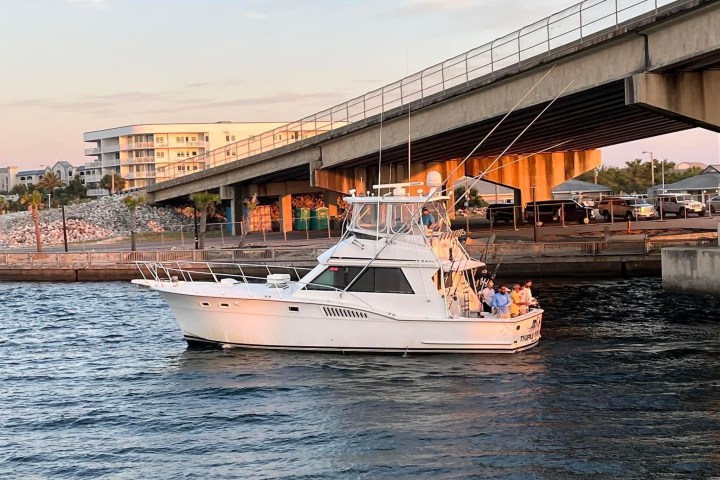 a boat is docked next to a body of water