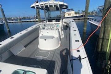 a boat is docked next to a body of water