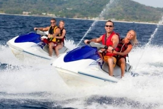 a man riding a jet ski in the water