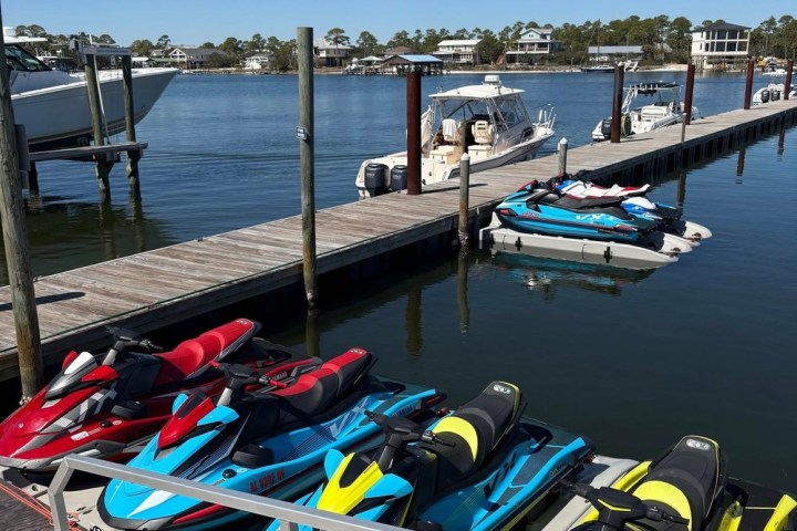 a boat is docked next to a body of water