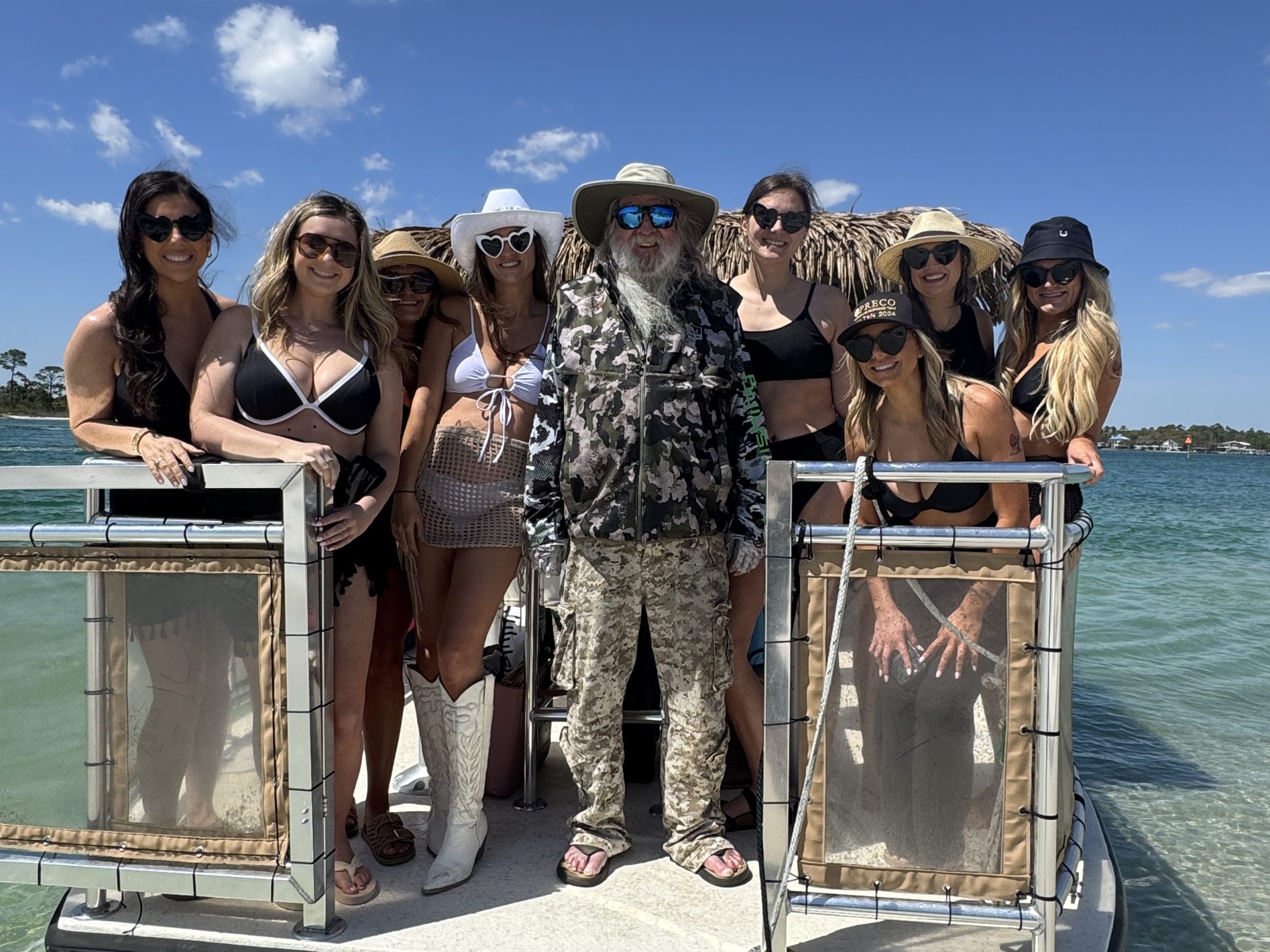 a group of people standing on a boat