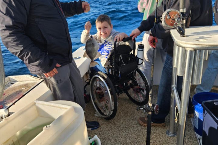 a group of people on a boat in the water